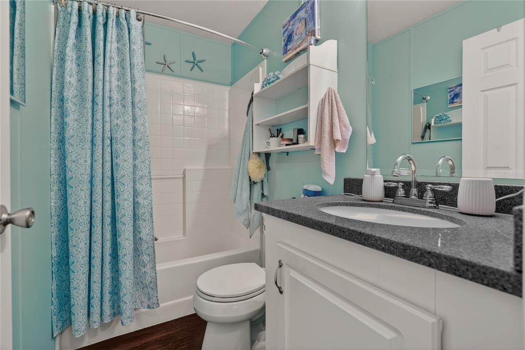 6249 South Esmeralda Terrace Lecanto, FL 34461 - Photo 31 of 61 a bathroom with a granite countertop sink toilet and shower