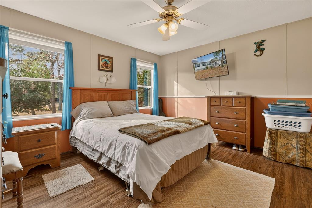 6249 South Esmeralda Terrace Lecanto, FL 34461 - Photo 32 of 61 a bedroom with a bed and wooden floor