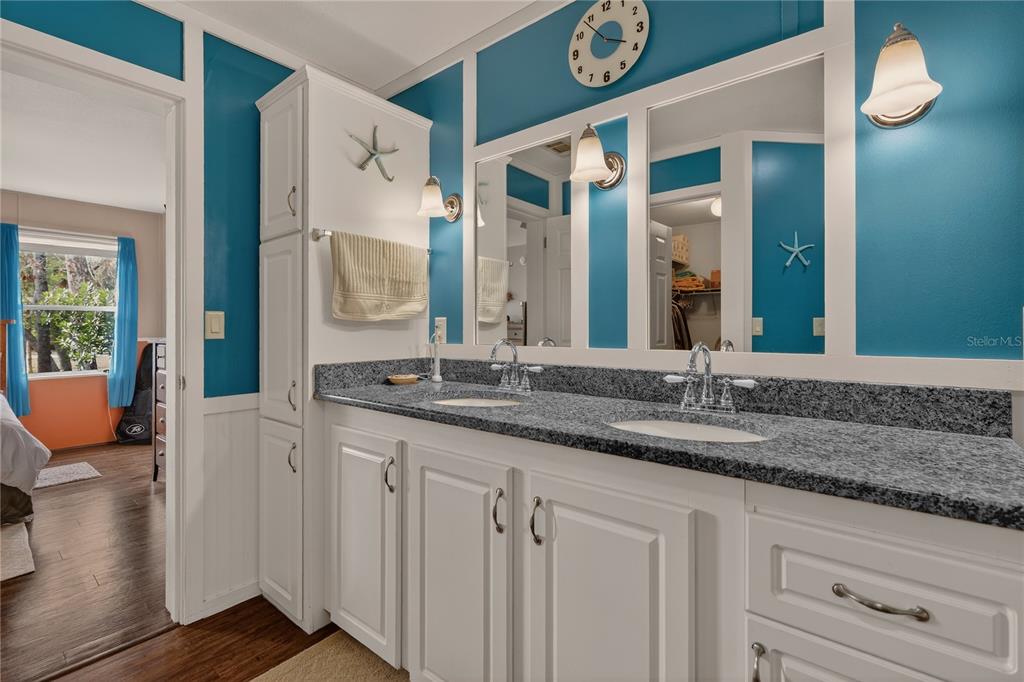 6249 South Esmeralda Terrace Lecanto, FL 34461 - Photo 34 of 61 a bathroom with a granite countertop sink and a mirror