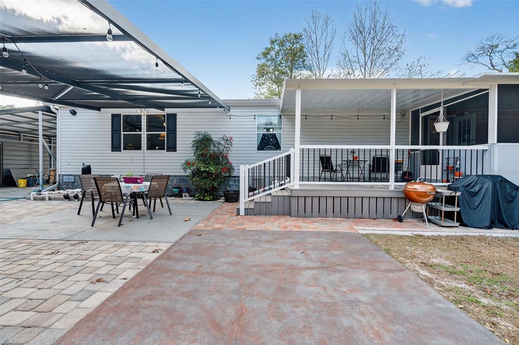 6249 South Esmeralda Terrace Lecanto, FL 34461 - Photo 45 of 61 a backyard of a house with table and chairs