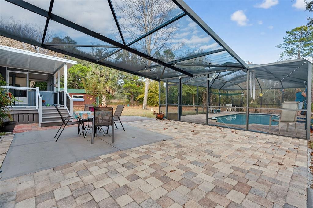 6249 South Esmeralda Terrace Lecanto, FL 34461 - Photo 46 of 61 a view of a backyard with table and chairs