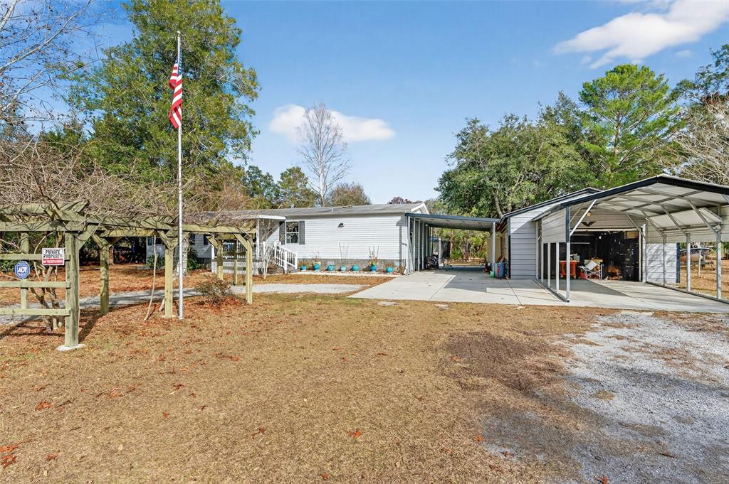 6249 South Esmeralda Terrace Lecanto, FL 34461 - Photo 48 of 61 a house view with a sitting space and garden