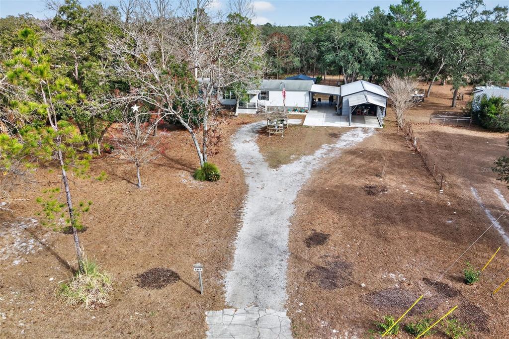 6249 South Esmeralda Terrace Lecanto, FL 34461 - Photo 53 of 61 a view of a city with tall trees