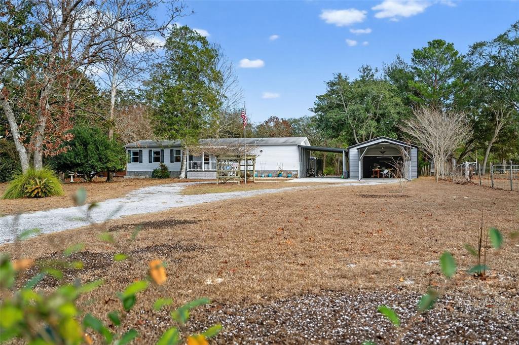 6249 South Esmeralda Terrace Lecanto, FL 34461 - Photo 6 of 61 a view of house with outdoor space and swimming pool