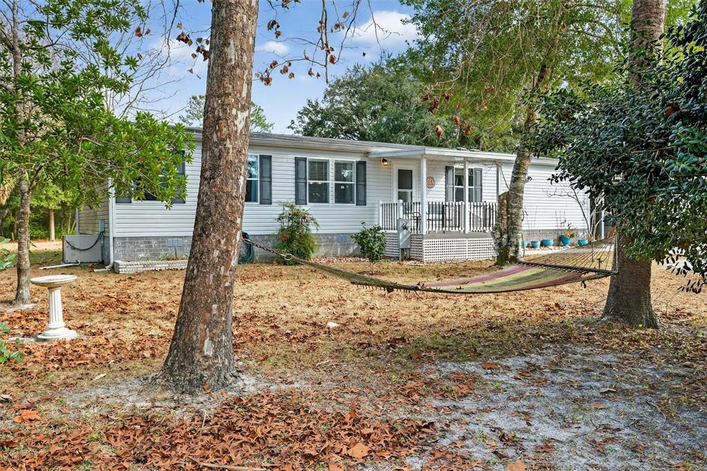 6249 South Esmeralda Terrace Lecanto, FL 34461 - Photo 7 of 61 a view of a house with a tree in the yard
