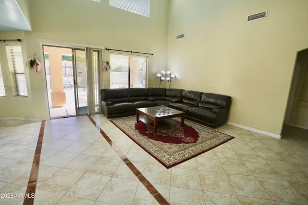 a living room with furniture and a rug