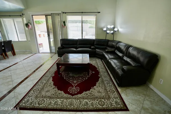 a living room with furniture and a rug