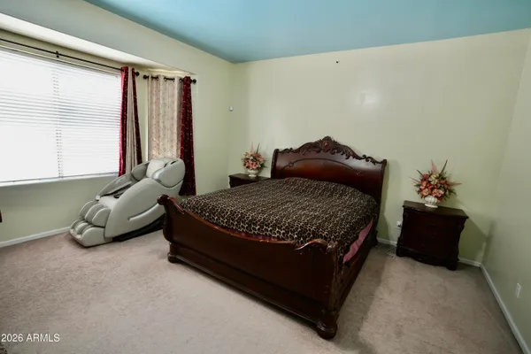 a bedroom with a bed and window