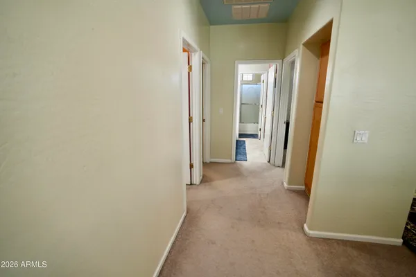 a view of a hallway with closet