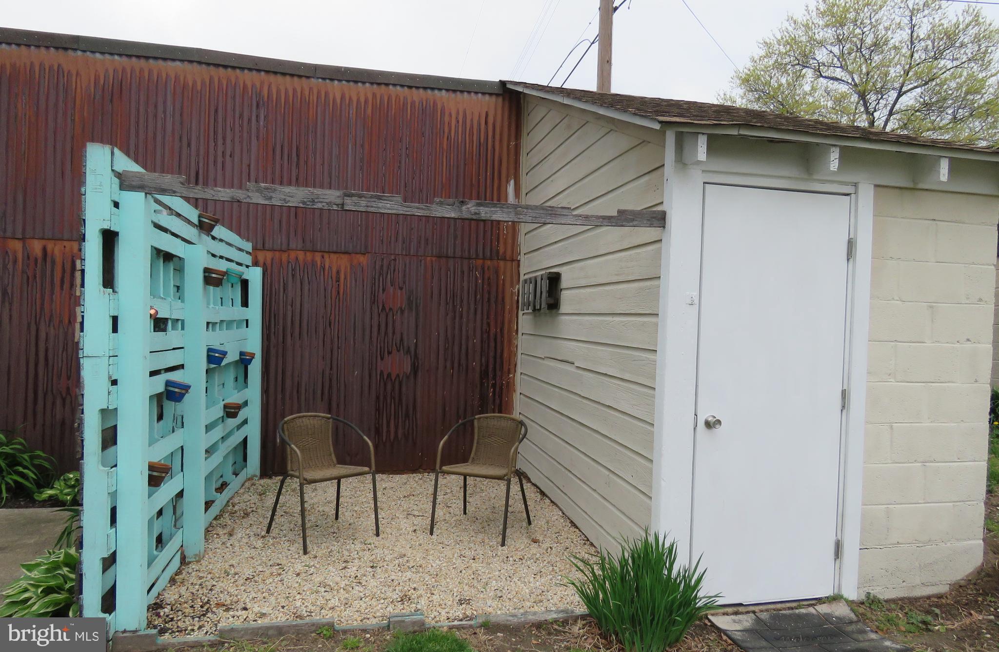 247 G Street Carneys Point, NJ 08069 - Photo 8 of 32 Outside seating area next to shed