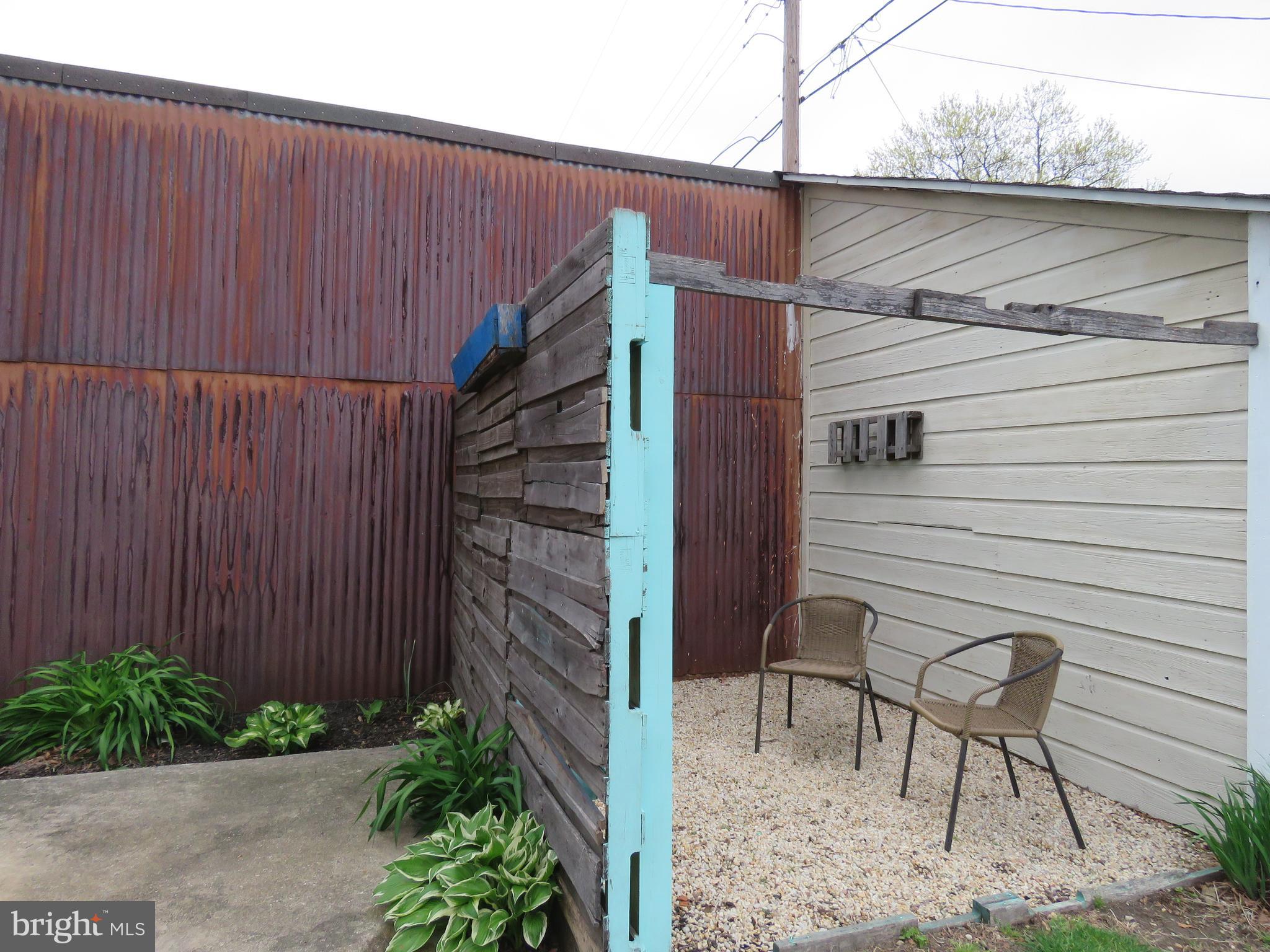 247 G Street Carneys Point, NJ 08069 - Photo 9 of 32 Outside seating area next to shed