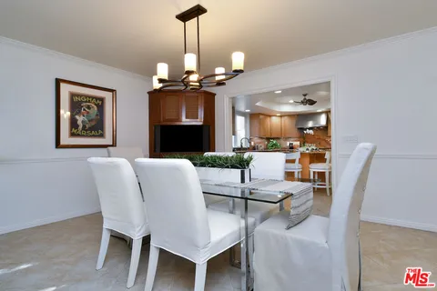 a kitchen with granite countertop kitchen island cabinets and stainless steel appliances