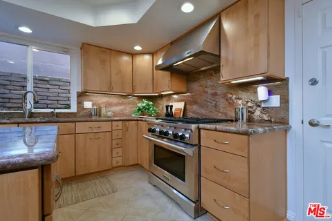 a living room with furniture and a large mirror