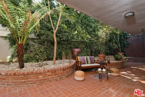 a view of a bench in a patio