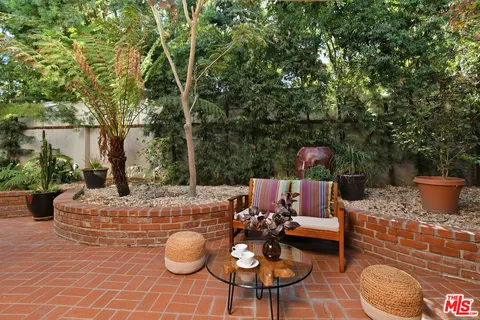 a view of a chairs and table in the patio