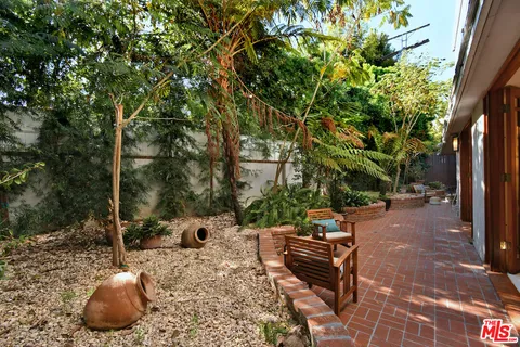 a bathroom with a sink a mirror and shower