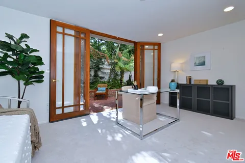 a bedroom with a bed and a couch