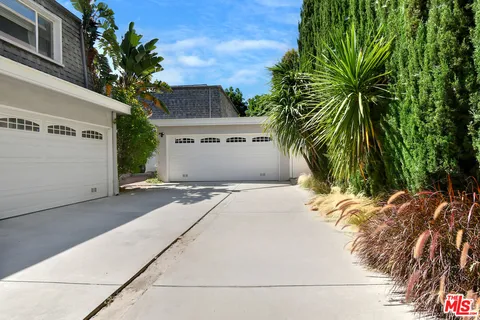 a view of a house with a street