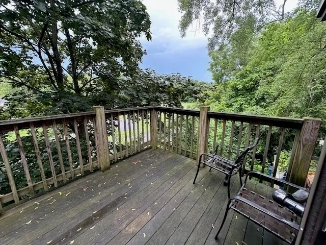 a view of deck with wooden floor and outdoor seating