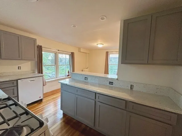 a kitchen with a sink cabinets and window