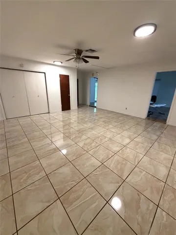 a view of a hallway with windows