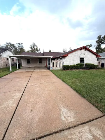 a view of house with yard