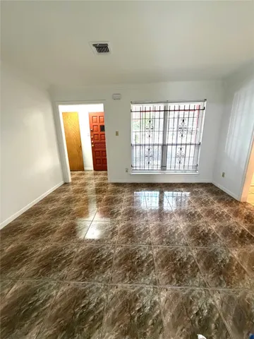 a view of an empty room and window