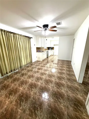 a kitchen with a sink and a window