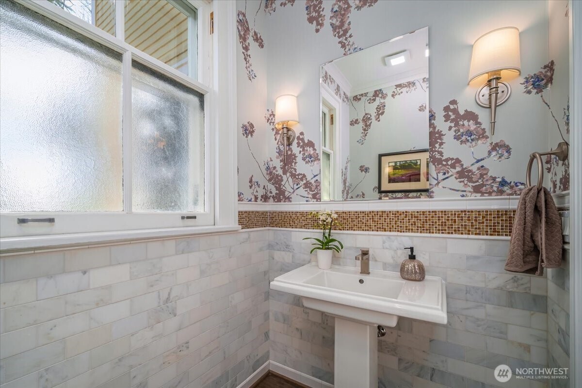 4200 Washington Avenue Seattle, WA 98199 - Photo 14 of 40 a bathroom with a sink and a mirror