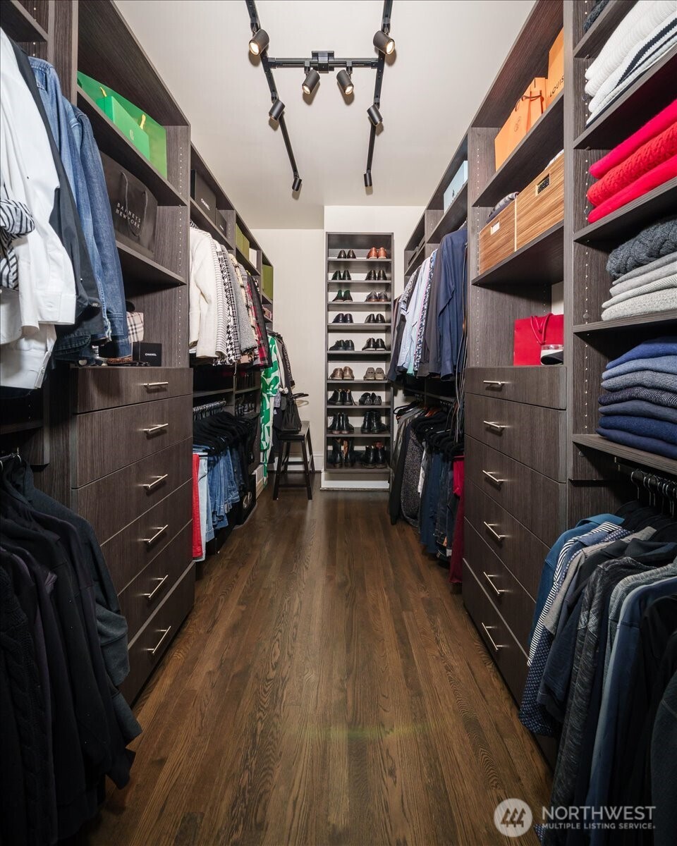 4200 Washington Avenue Seattle, WA 98199 - Photo 23 of 40 a view of walk in closet with clothes and shoes