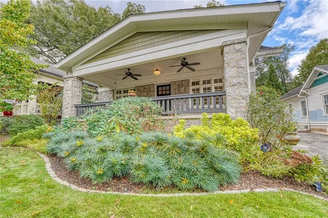 a view of house with a yard