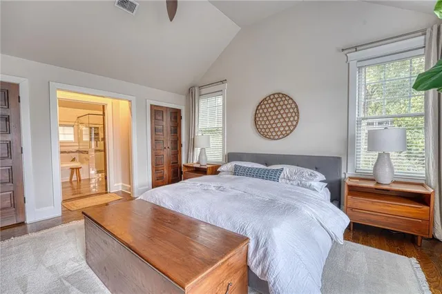 a bedroom with a bed and a window