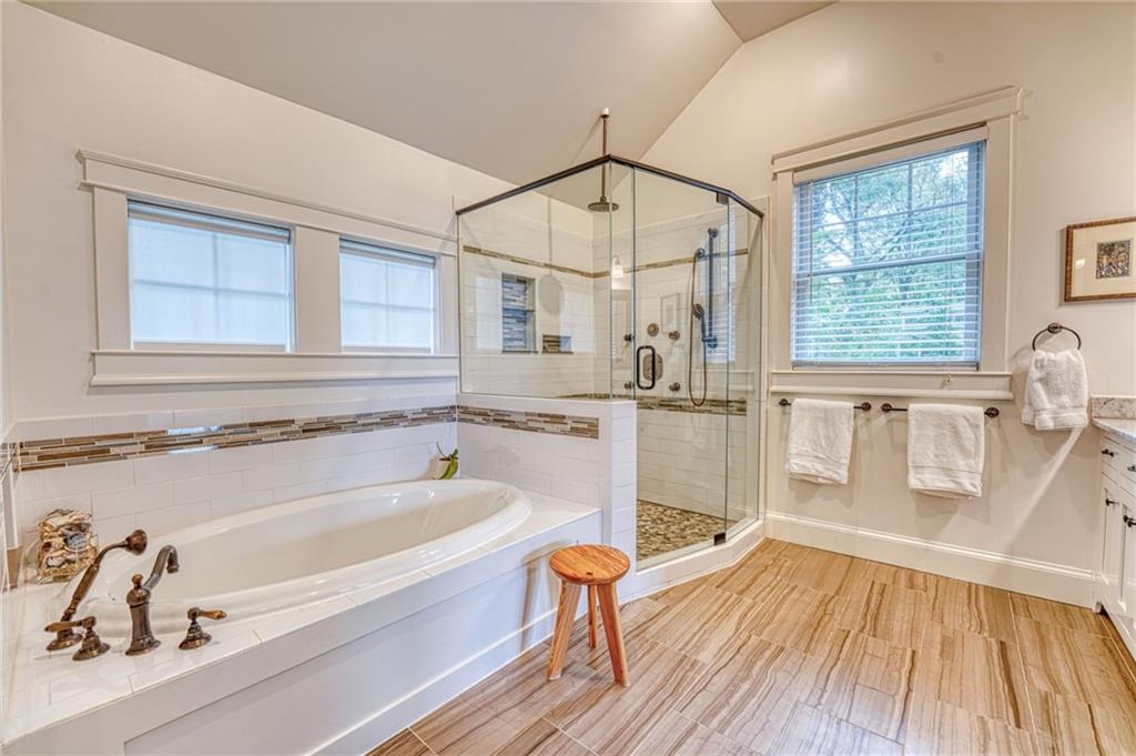 997 Blue Ridge Avenue Northeast Atlanta, GA 30306 - Photo 34 of 53 a bathroom with a bathtub and a shower