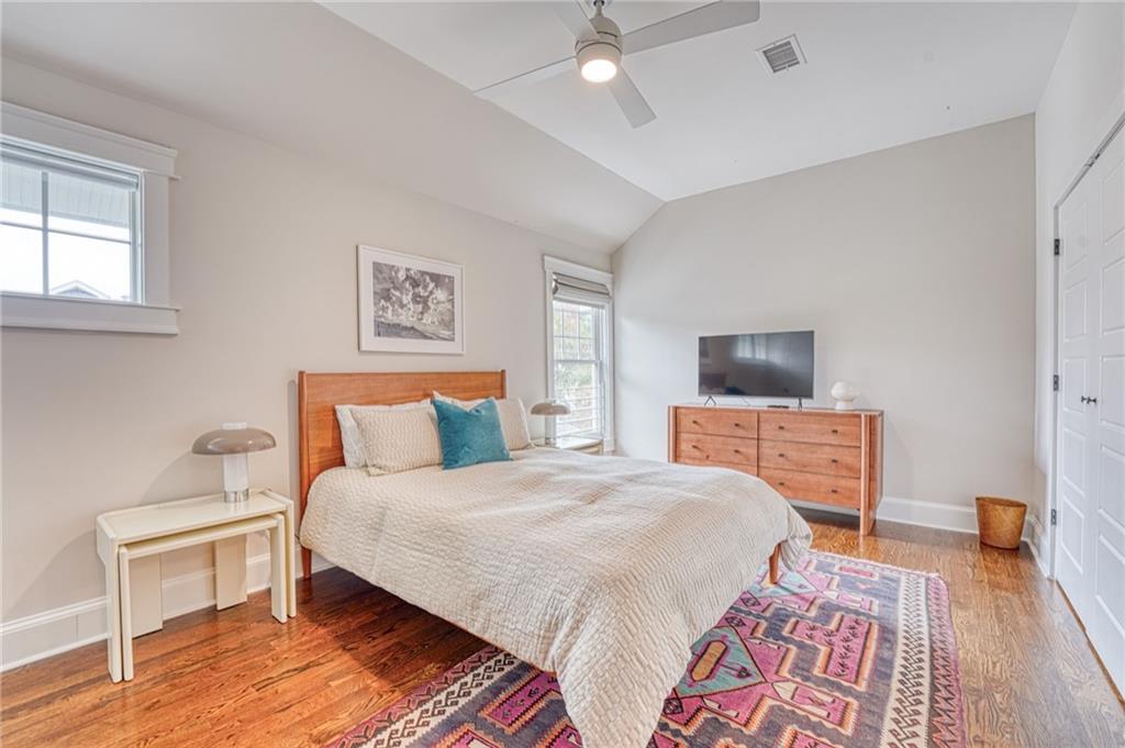 997 Blue Ridge Avenue Northeast Atlanta, GA 30306 - Photo 37 of 53 a bedroom with a bed and wooden floor