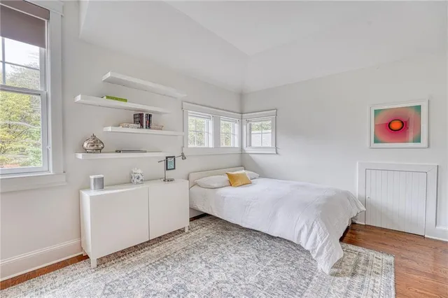 a bedroom with a bed and a couch