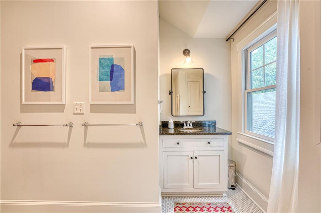 997 Blue Ridge Avenue Northeast Atlanta, GA 30306 - Photo 44 of 53 a bathroom with a sink a vanity and a mirror
