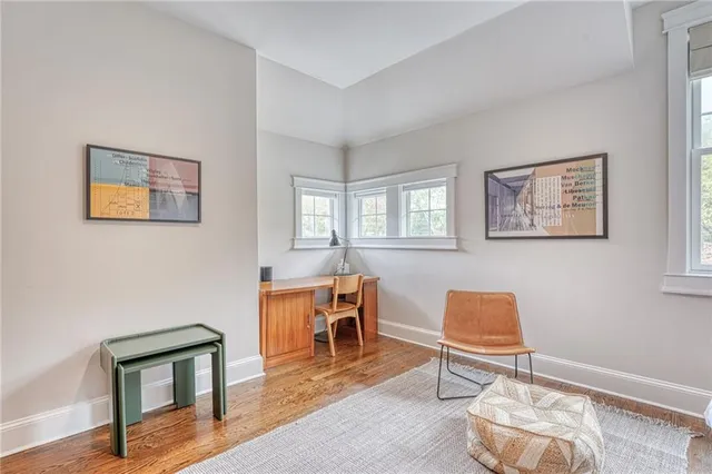 a view of a livingroom with furniture and windows