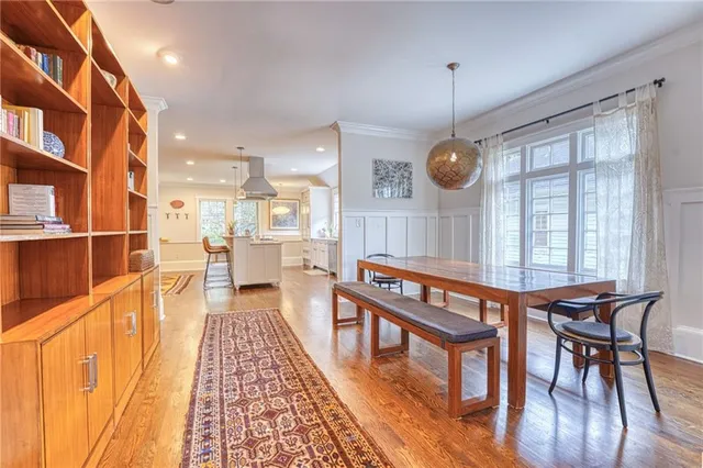 a very nice looking dining room with a large window with outer view