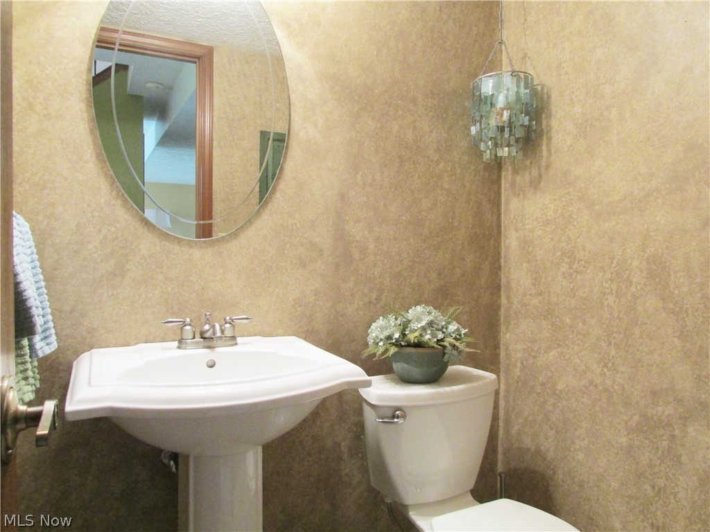 1481 Welch Road Painesville, OH 44077 - Photo 20 of 23 Even the powder room at the main floor entry received a recent update.
