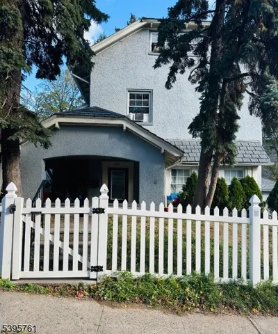 a view of a house with a small yard