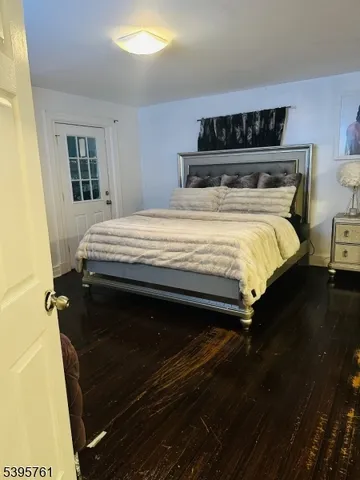 a bedroom with a bed and dresser