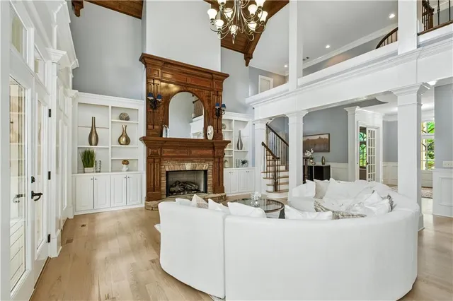 a kitchen with stainless steel appliances a sink a stove and a wooden floors