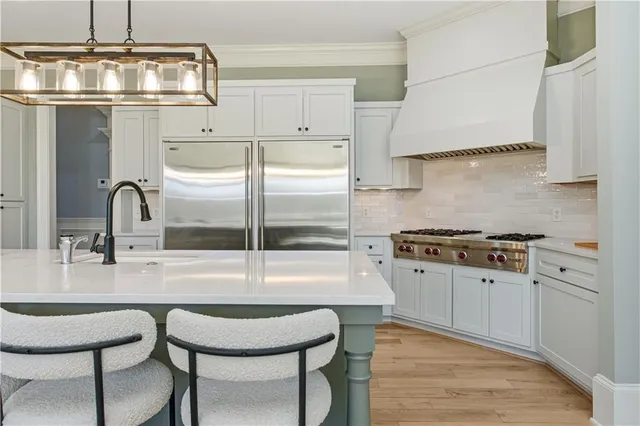 a living room with furniture and a view of kitchen