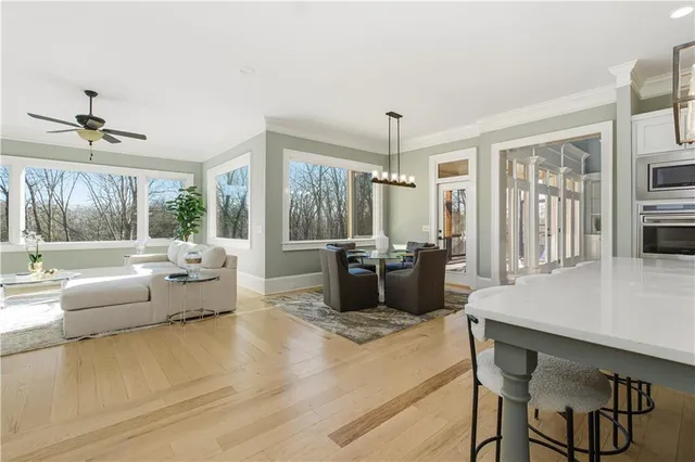a view of a work space with wooden floor and a potted plant