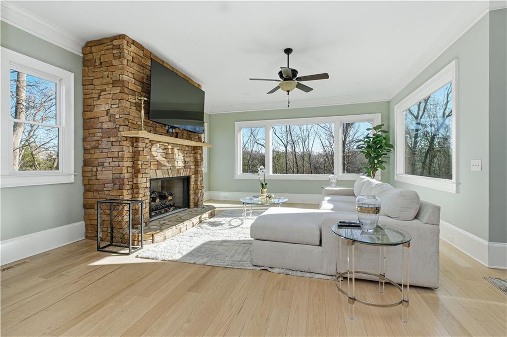6225 Random Winds Bluff Gainesville, GA 30506 - Photo 29 of 96 a living room with fireplace furniture and a flat screen tv