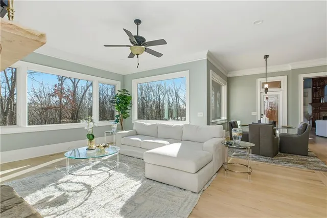 a spacious bedroom with a bed and a large window
