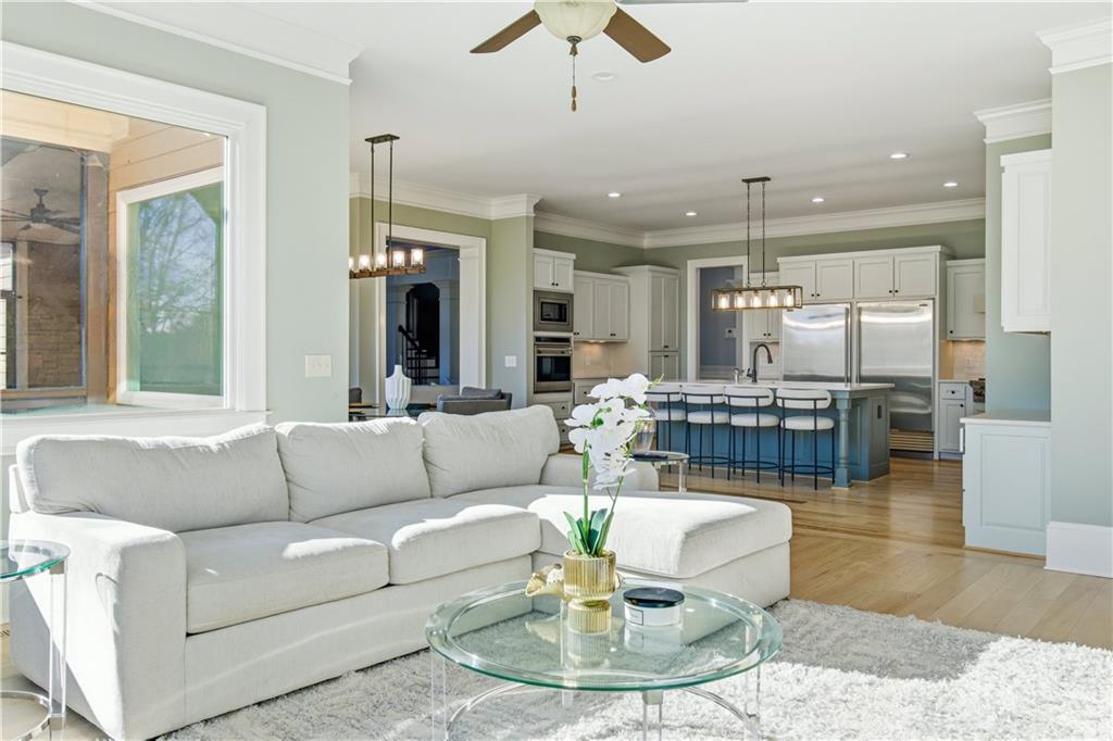 6225 Random Winds Bluff Gainesville, GA 30506 - Photo 32 of 96 a living room with furniture and a view of kitchen