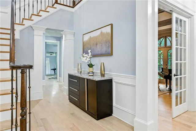 a bedroom with a bed and a chandelier