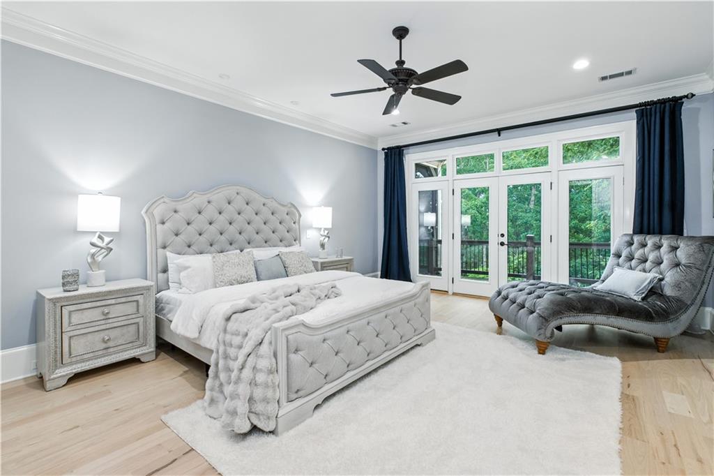 6225 Random Winds Bluff Gainesville, GA 30506 - Photo 37 of 96 a bedroom with a large bed and a large window