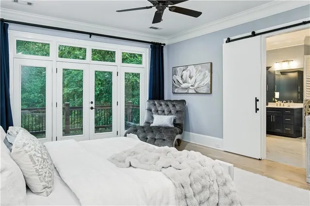 a en suite bathroom with a granite countertop sink and a mirror